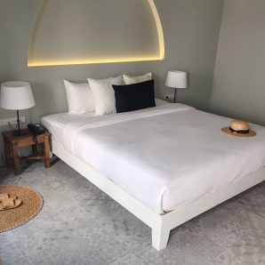 Clean hotel room with wooden bunk beds. Vintage effect style pictures.